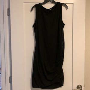 Black midi dress with cinched detail on bottom/side